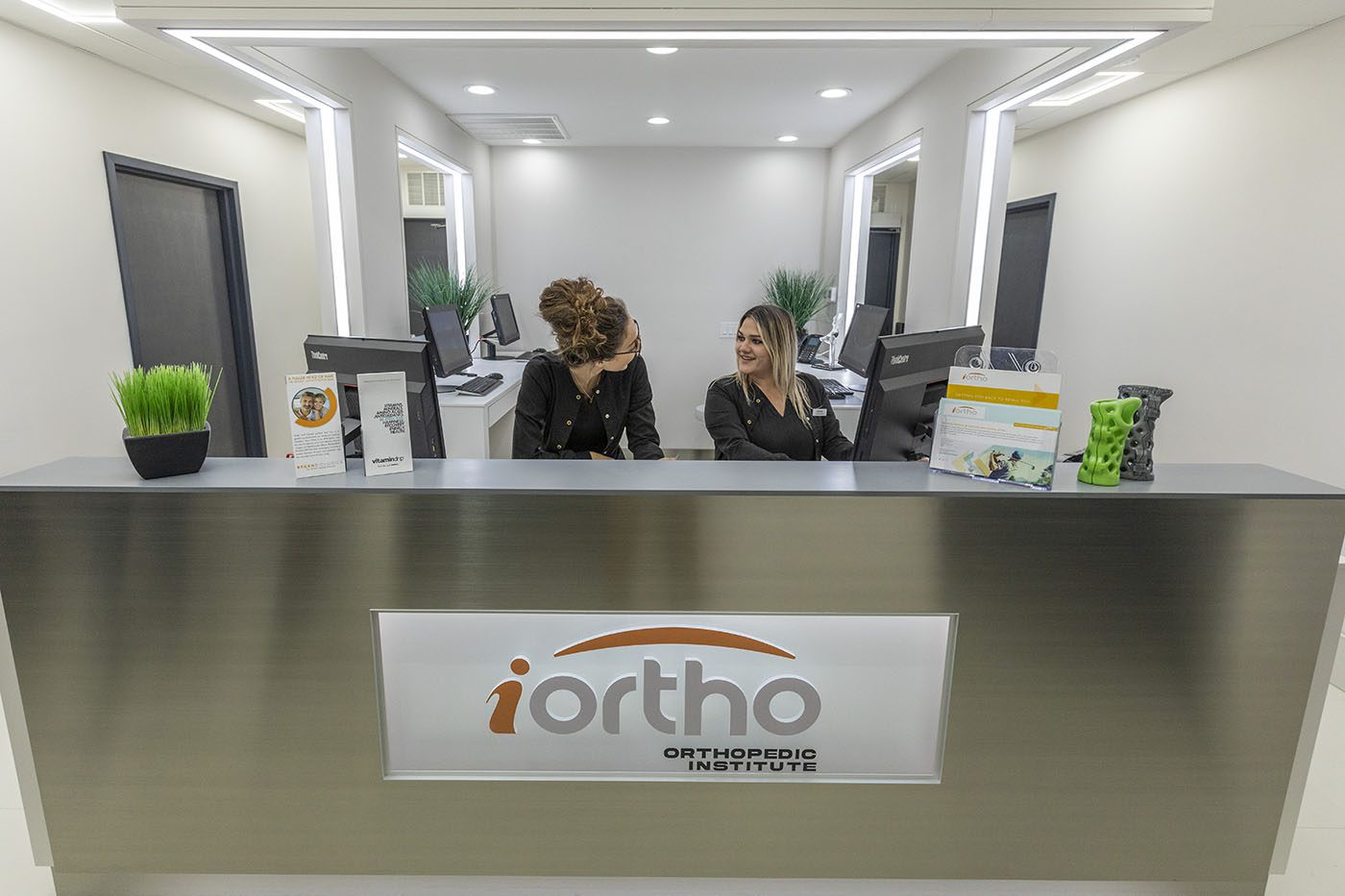 Staff sitting in the offices of iOrtho - The Orthopedic Institute